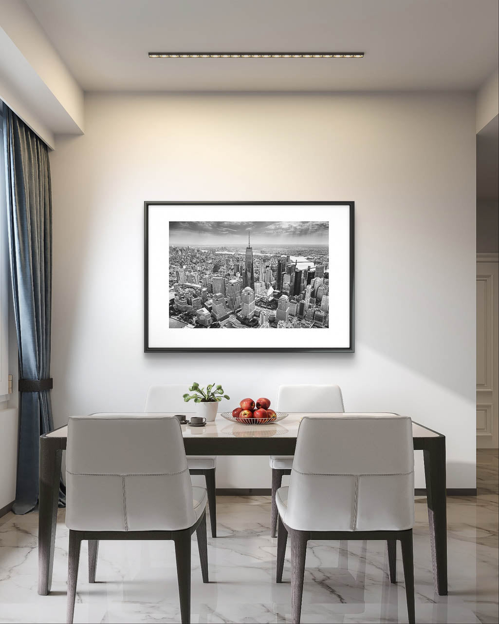 Modern dining table with a tray of fresh apples in glass bowl . minimalisti c wall with Black and white photograph of skyscrapers an buildings of New York City. Helicopter View. Focal point is One World Trade Center.