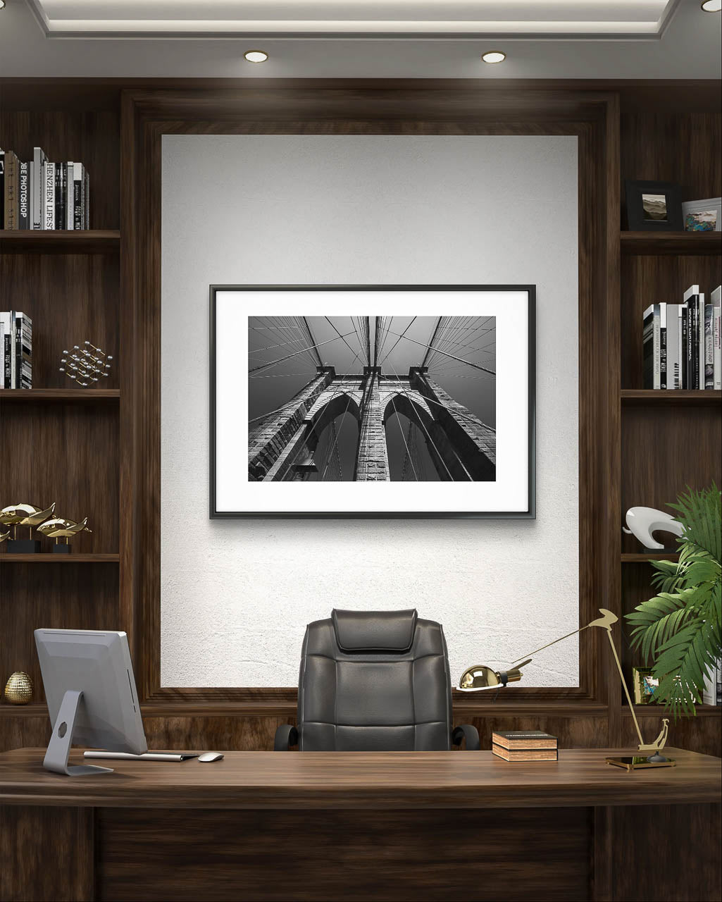 home library of rich gentleman. on the wall is hanged up a photograph of Brooklyn Bridge, fine art black and white print. Shot from the perspective of a pedestrian looking up, the image highlights the intricate Neogothic arches of one of the bridge's towers. Fine art photography print. Limited Edition, NYC, New York City, USA