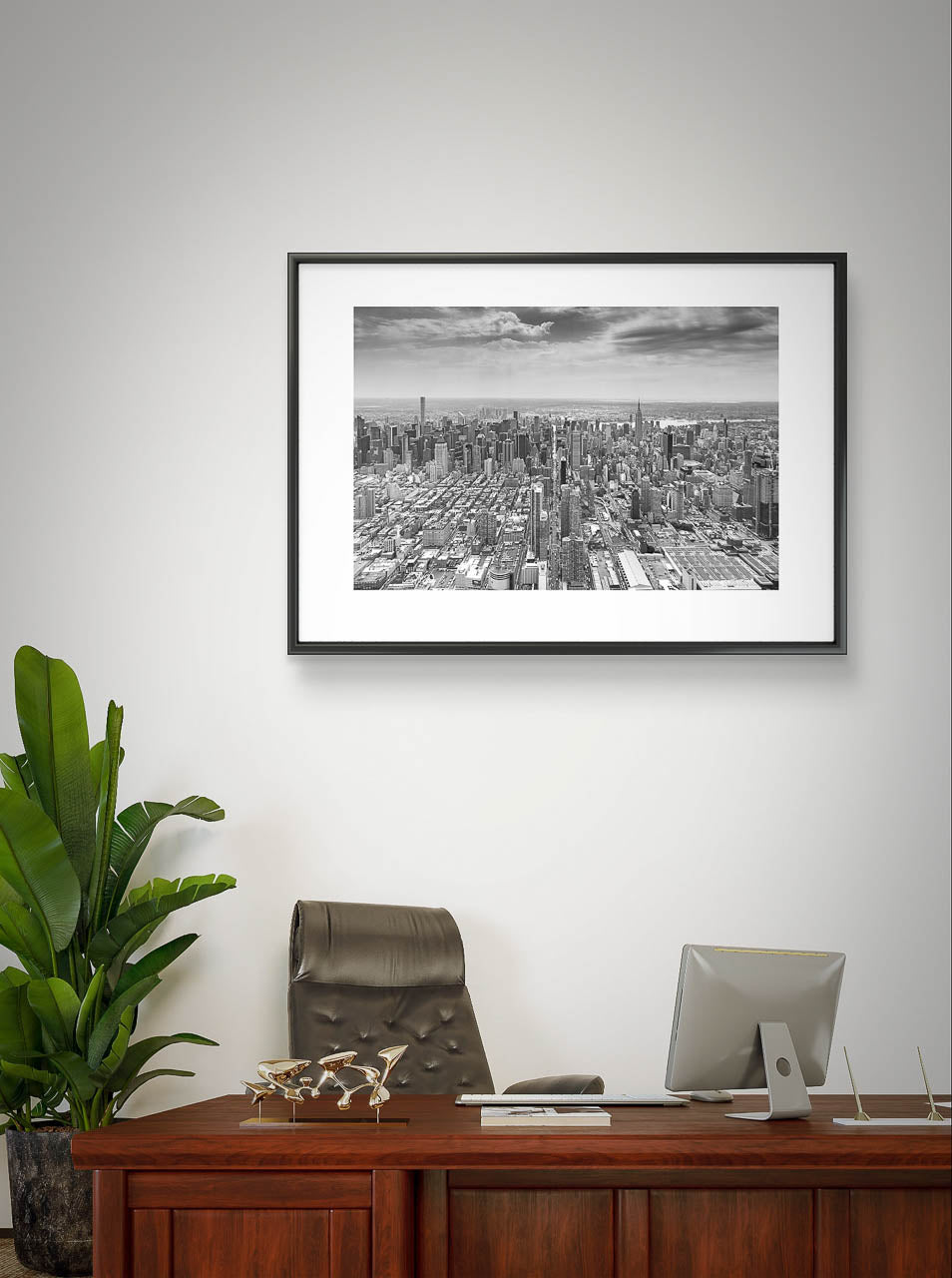 Office . A desk and chair. Large plant in the corner. On the wall a photograph of Manhattan's iconic 42nd Street stretching for its entire two-mile length. Captured from a helicopter, Fine Art Photography Print. Limited Edition. New York City, USA, NYC, 42 Street.