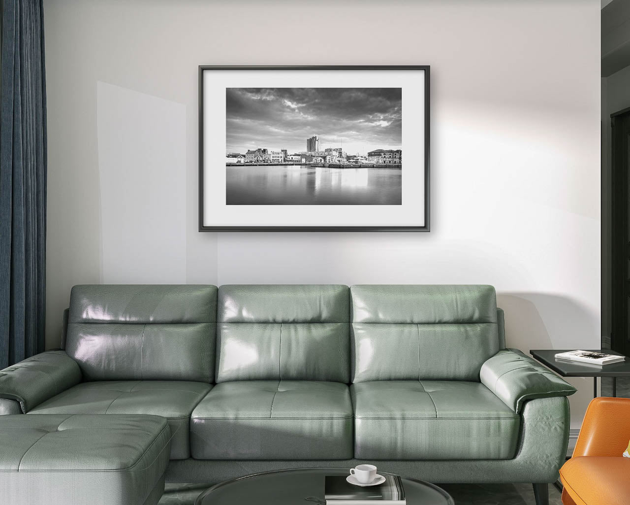 Large Grey sofa , white wall and Black and white framed Fine Art photograph of a calm waterfront scene with industrial buildings in the focal point. The long exposure effect creates smooth water reflections. streaked clouds in the sky, enhancing the tranquil, moody atmosphere of the port area .Albert Quay & Victoria Rd.  Limited Edition Print, Fine Art photography, Cork City, Ireland
