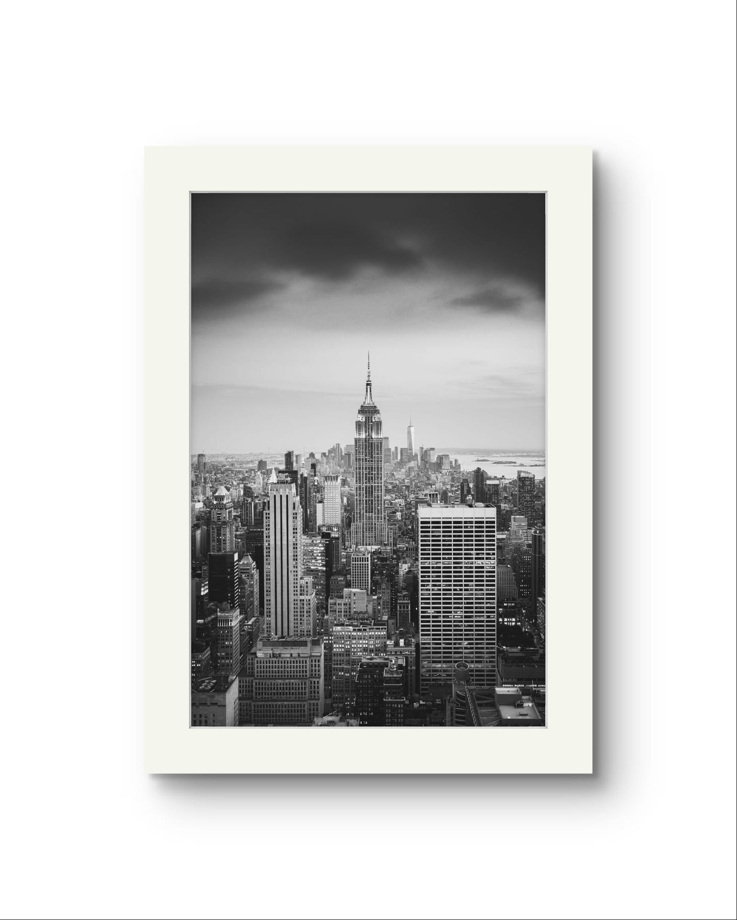 Unframed Black and white photography print. A breathtaking view of Manhattan from the terrace of the Rockefeller Centre, looking southward, with the majestic Empire State Building commanding the scene as the focal point. New York City.