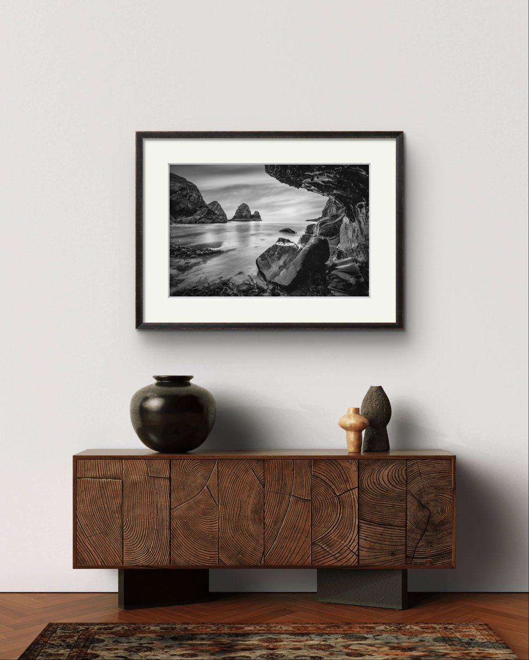 wooden console table with a fine art photography print over it. Print of a Irish coastal landscape. Wild Atlantic Way. Cork Ireland.  Nohoval Cove