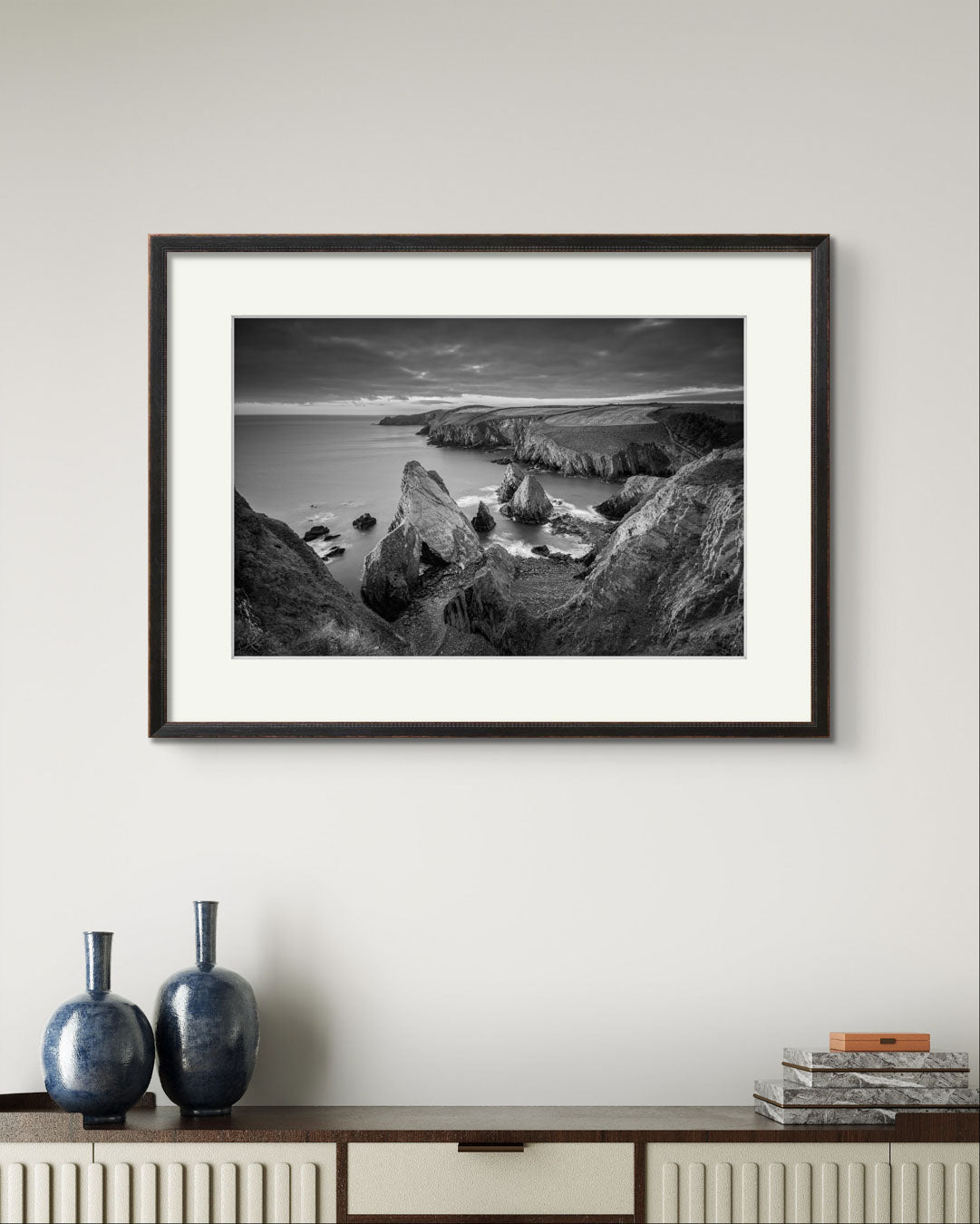 Console table and over it Framed black and white photograph of coastal landscape. Cork Ireland