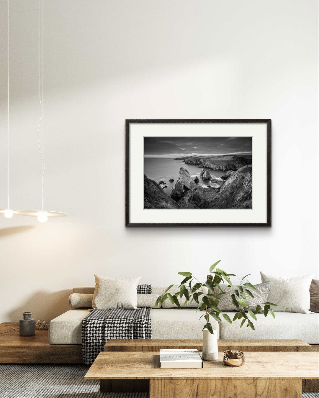 living room settings. Framed black and white photograph of coastal landscape. is hanging on the wall. Cork Ireland