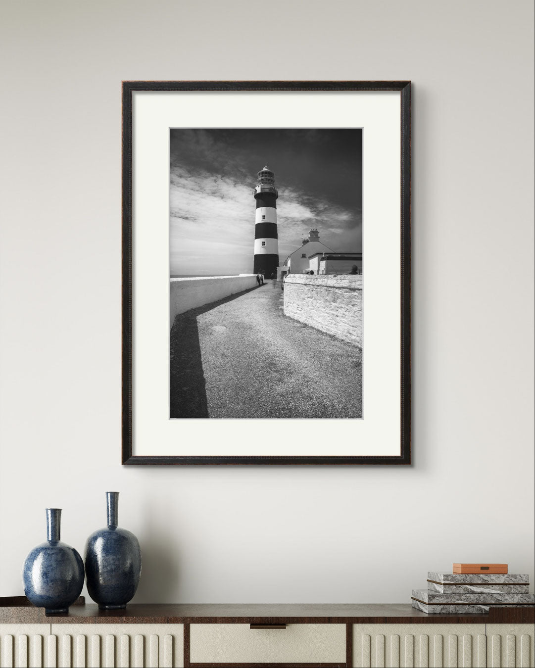 a console table and above fine art photography print of a lighthouse on The Wild Atlantic Way. Cork. Kinsale. Irish coast.