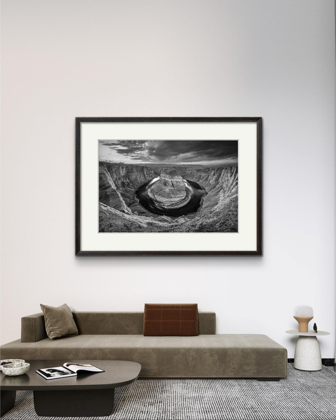 empty room with large sofa. on the wall home decor wall art. Framed, Black and white fine art photography print of a horseshoe-shaped incised meander of the Colorado River, Page, Arizona. USA