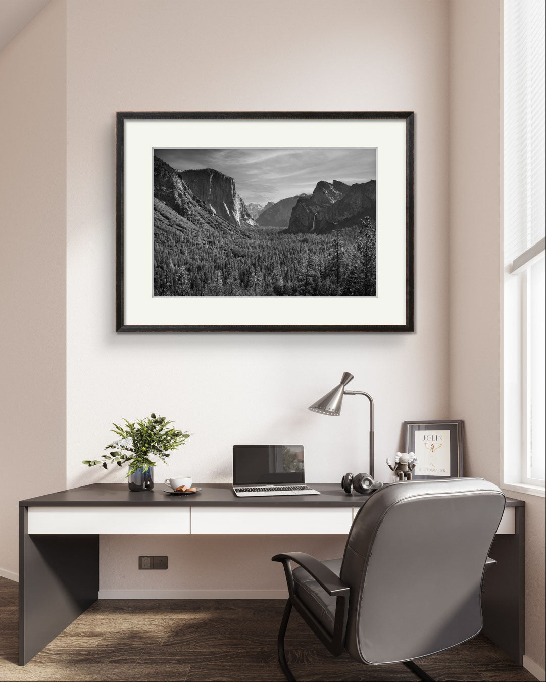 a quiet office room with stylish decor. Wall art as a framed fine art photography print of the Yosemite Valley. Made famous by Ansel Adams. Valley View. California. USA