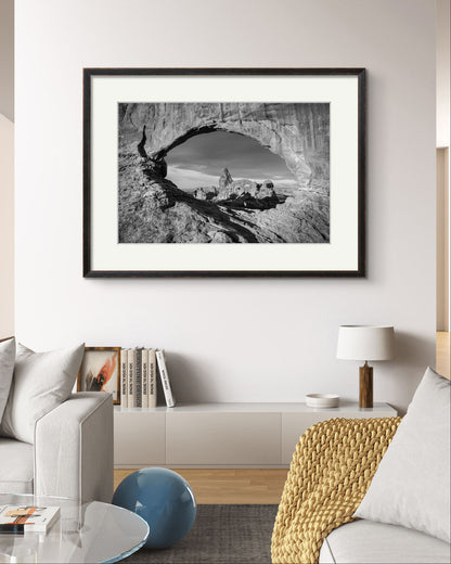 bright room with many home decor elements. on the wall large piece of a wall art. Fine art photography print of Arches National Park, Utah, United States. Turret Arch. Rock arch. View of Turret Arch. Moab, Utah, USA