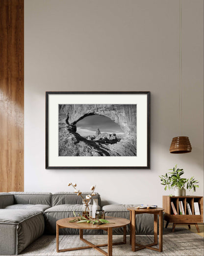 sunny living room in a modern home. Framed Fine art photography print of Arches National Park, Utah, United States. Turret Arch. Rock arch. View of Turret Arch. Moab, Utah, USA