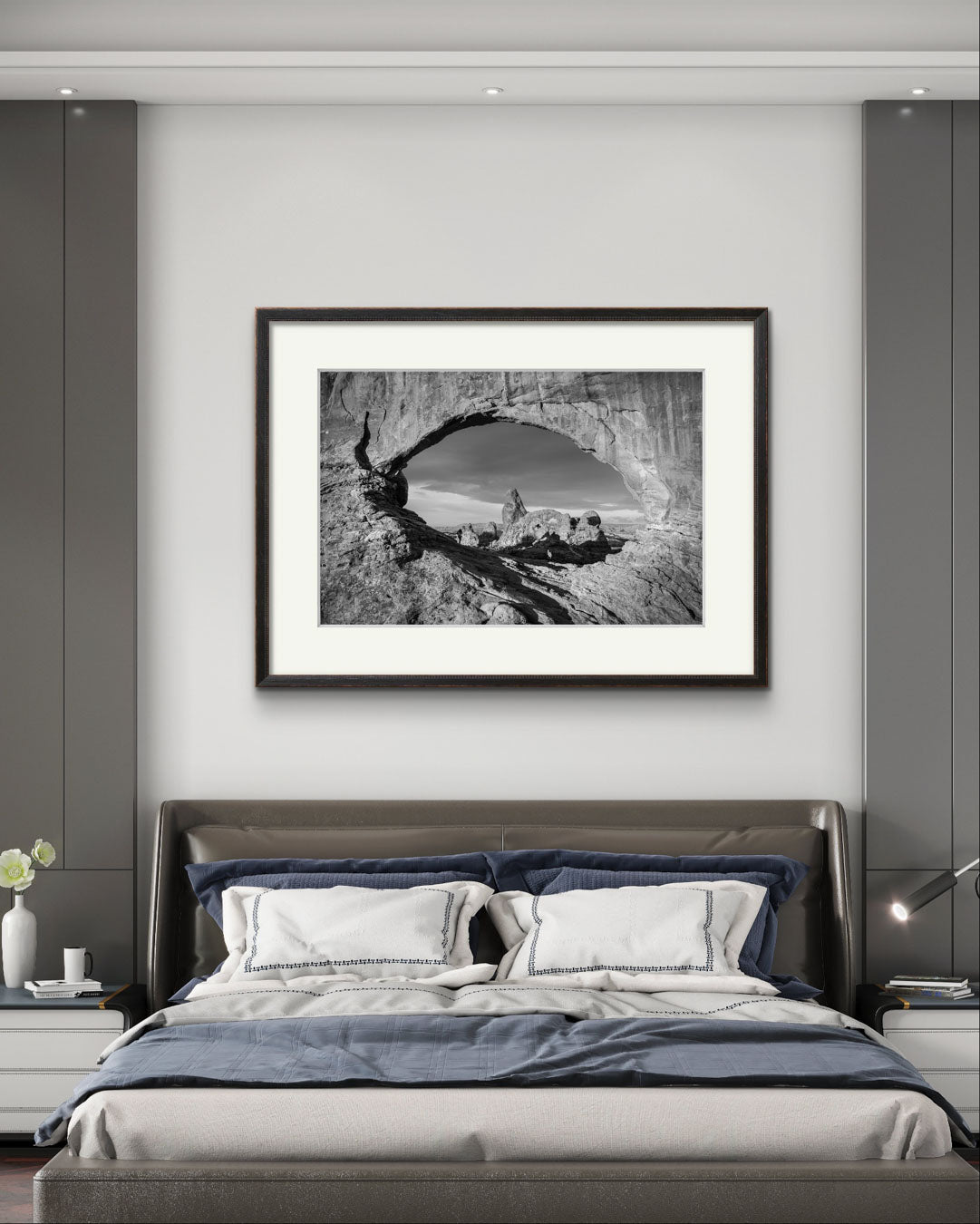 A hotel room with a modern wall art. Fine art photography print of Arches National Park, Utah, United States. Turret Arch. Rock arch. View of Turret Arch. Moab, Utah, USA