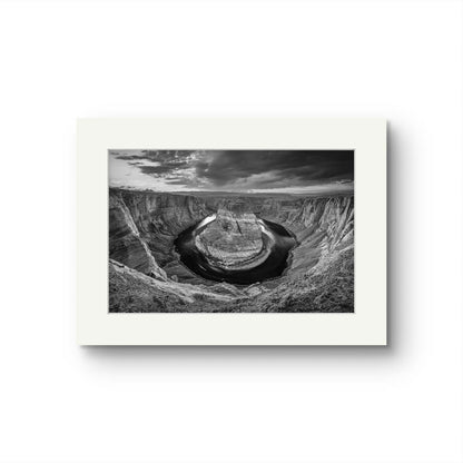 Black and white fine art photography print of a horseshoe-shaped incised meander of the Colorado River, Page, Arizona. USA