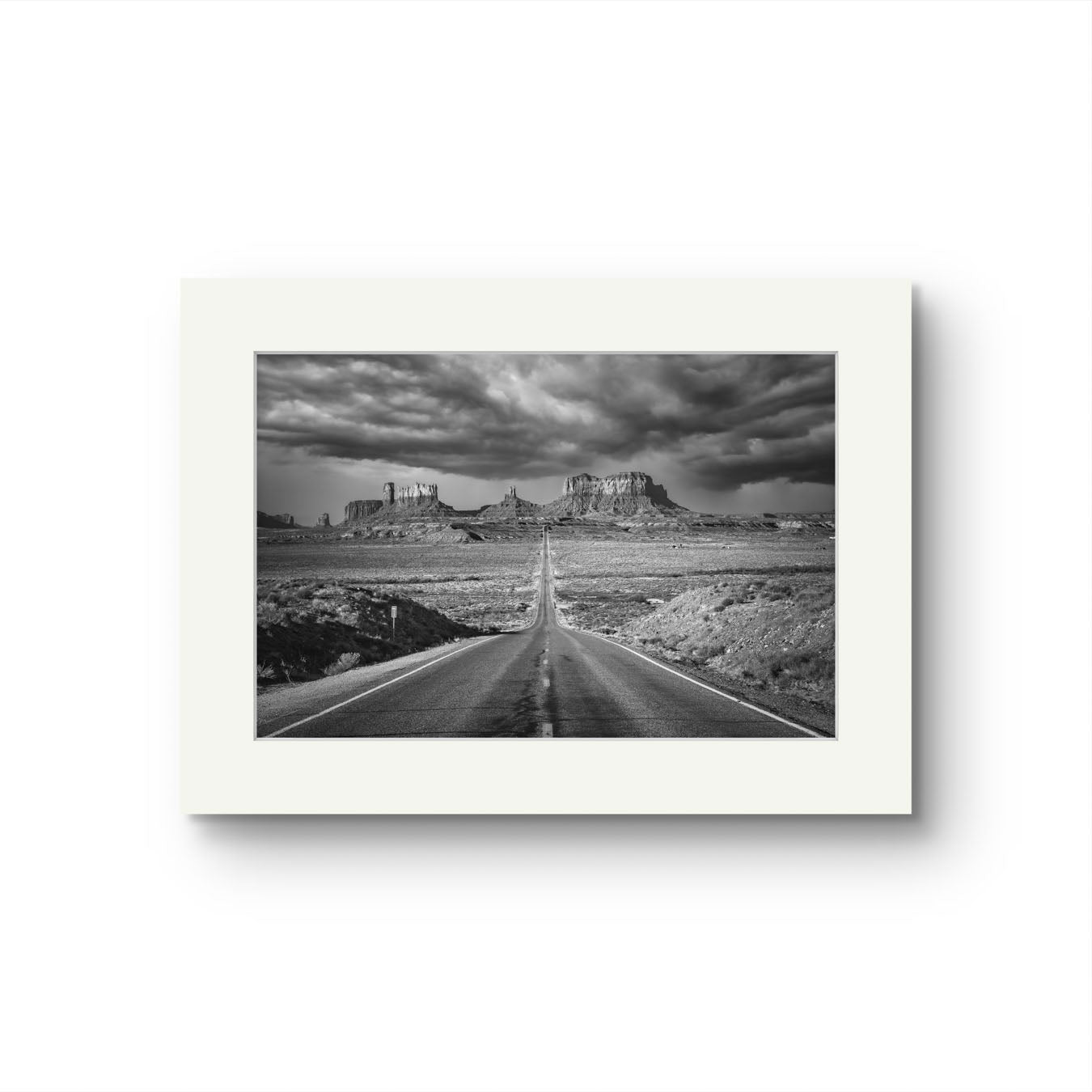 a fine art photography print. Black and white  of a famous Forrest Gump Point. US Scenic Highway 163.  Navajo Reservation. Monument Valley. USA