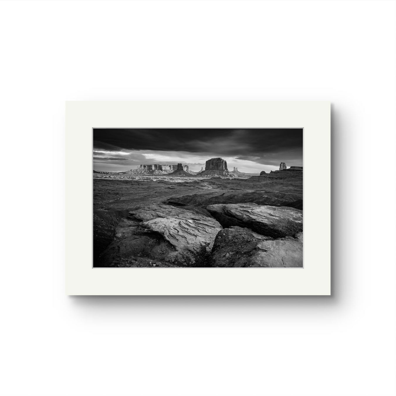 A fine art photography print showcasing one of the most iconic and scenic spots in the Navajo Tribal Park in Monument Valley. Lookout with sweeping vistas of craggy buttes. USA