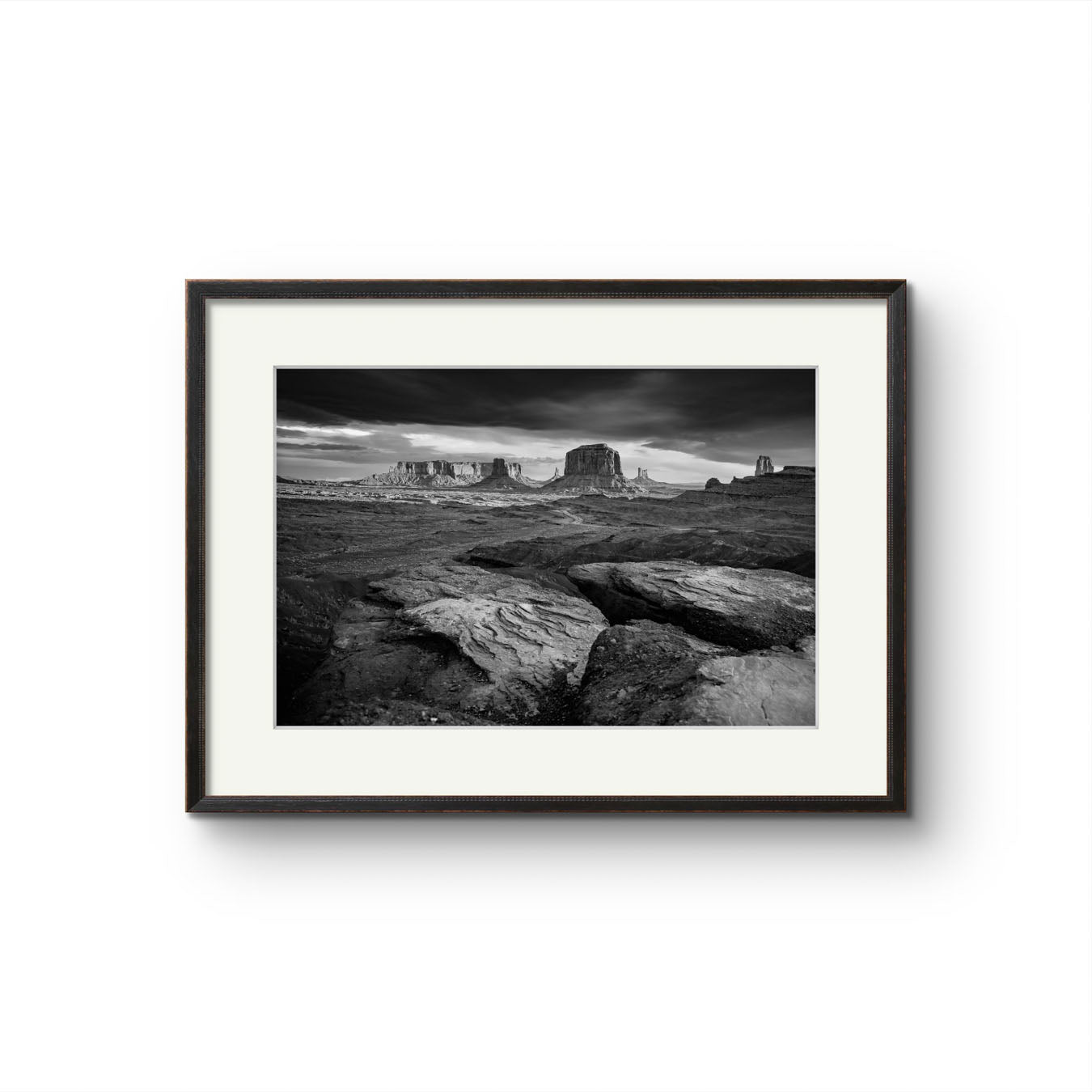 Framed fine art photography print showcasing one of the most iconic and scenic spots in the Navajo Tribal Park in Monument Valley. Lookout with sweeping vistas of craggy buttes. USA