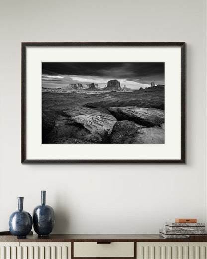 A large Framed fine art photography print showcasing one of the most iconic and scenic spots in the Navajo Tribal Park in Monument Valley. Lookout with sweeping vistas of craggy buttes. USA